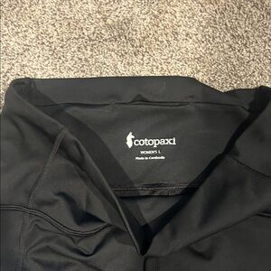 Cotopaxi Women's leggins.  Black with burgundy at ankle